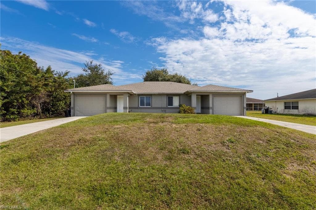 725/727 Ivan AVE S LEHIGH ACRES, FL 33973