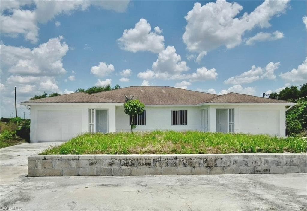 1591 / 1589 Gilbert AVE S LEHIGH ACRES, FL 33973