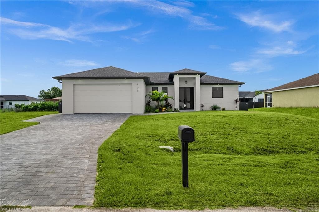 409 NW 25TH PL CAPE CORAL, FL 33993